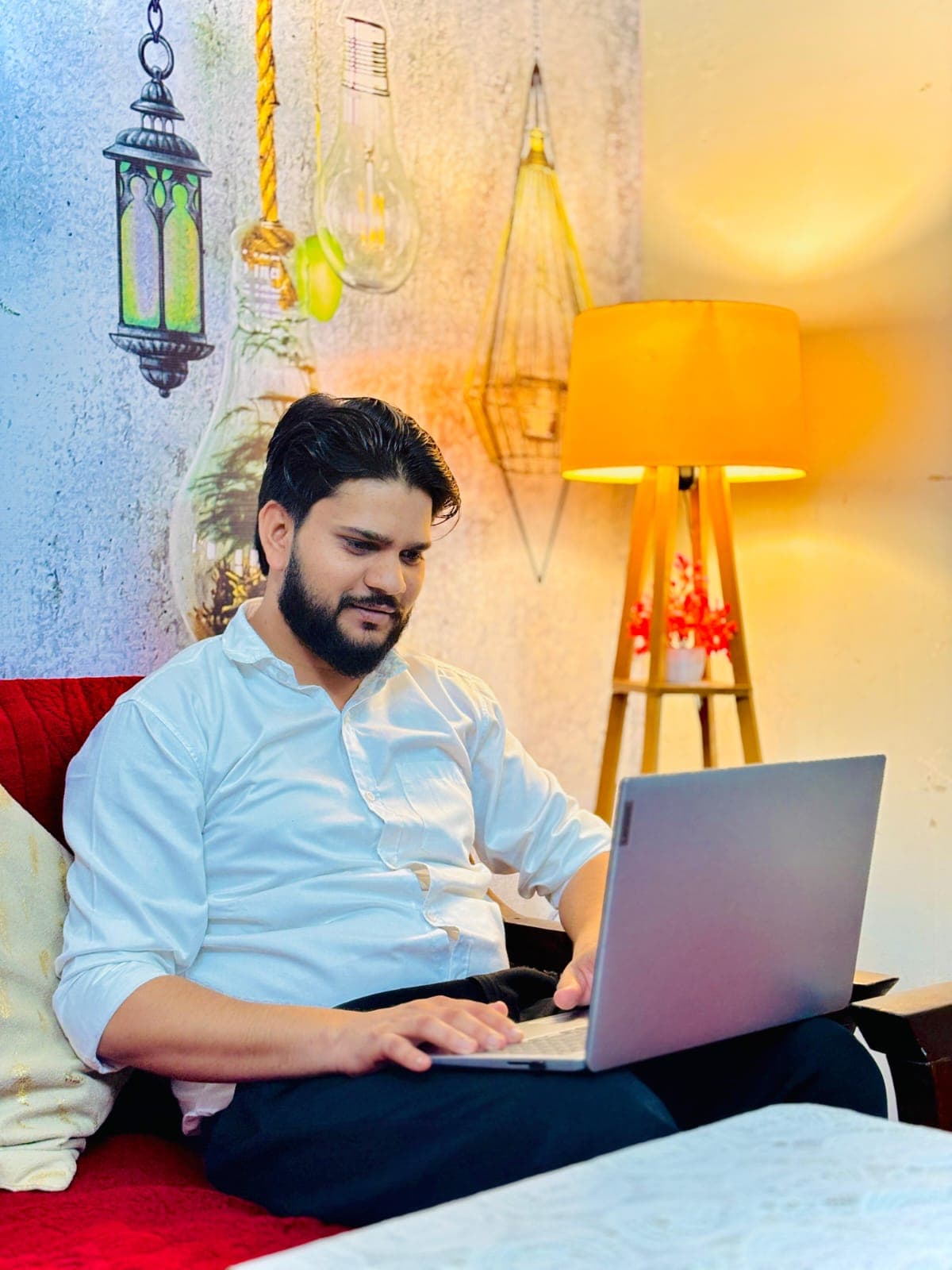 Arun, founder of SkillMediaX, working on a laptop
